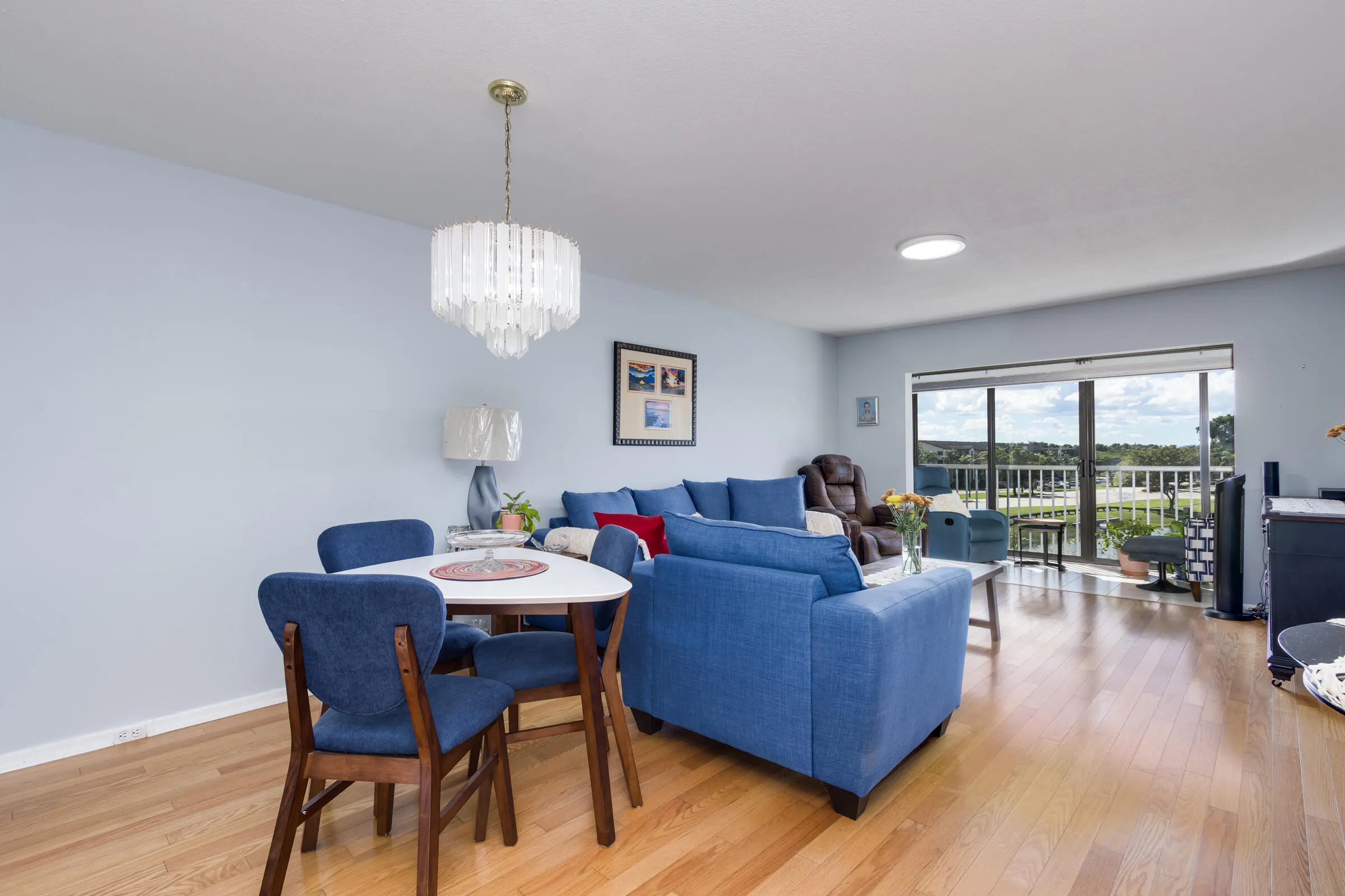 Dining & Living areas include wood flooring with lakefront views from extended balcony