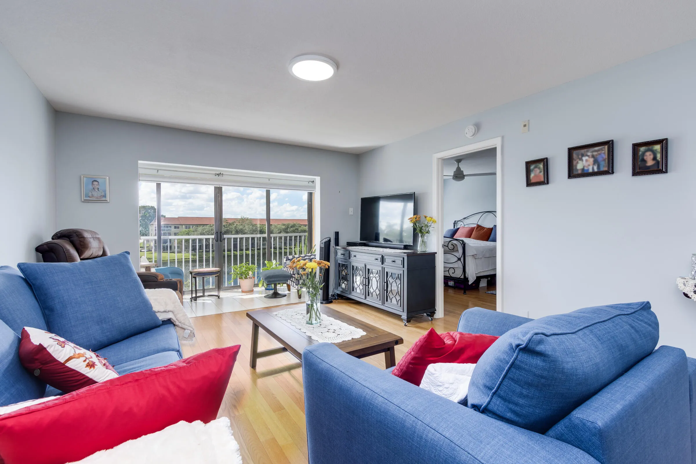 Living area with access to both Balcony and Master Bedroom with wide lake views