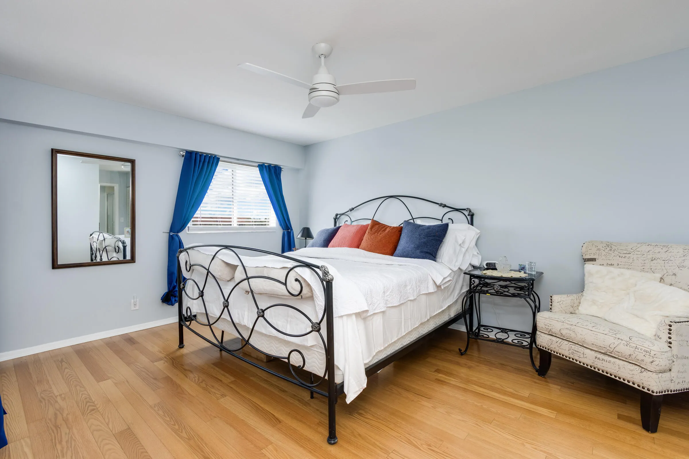 Spacious master bedroom can accommodate a king size bed + end tables & sitting area