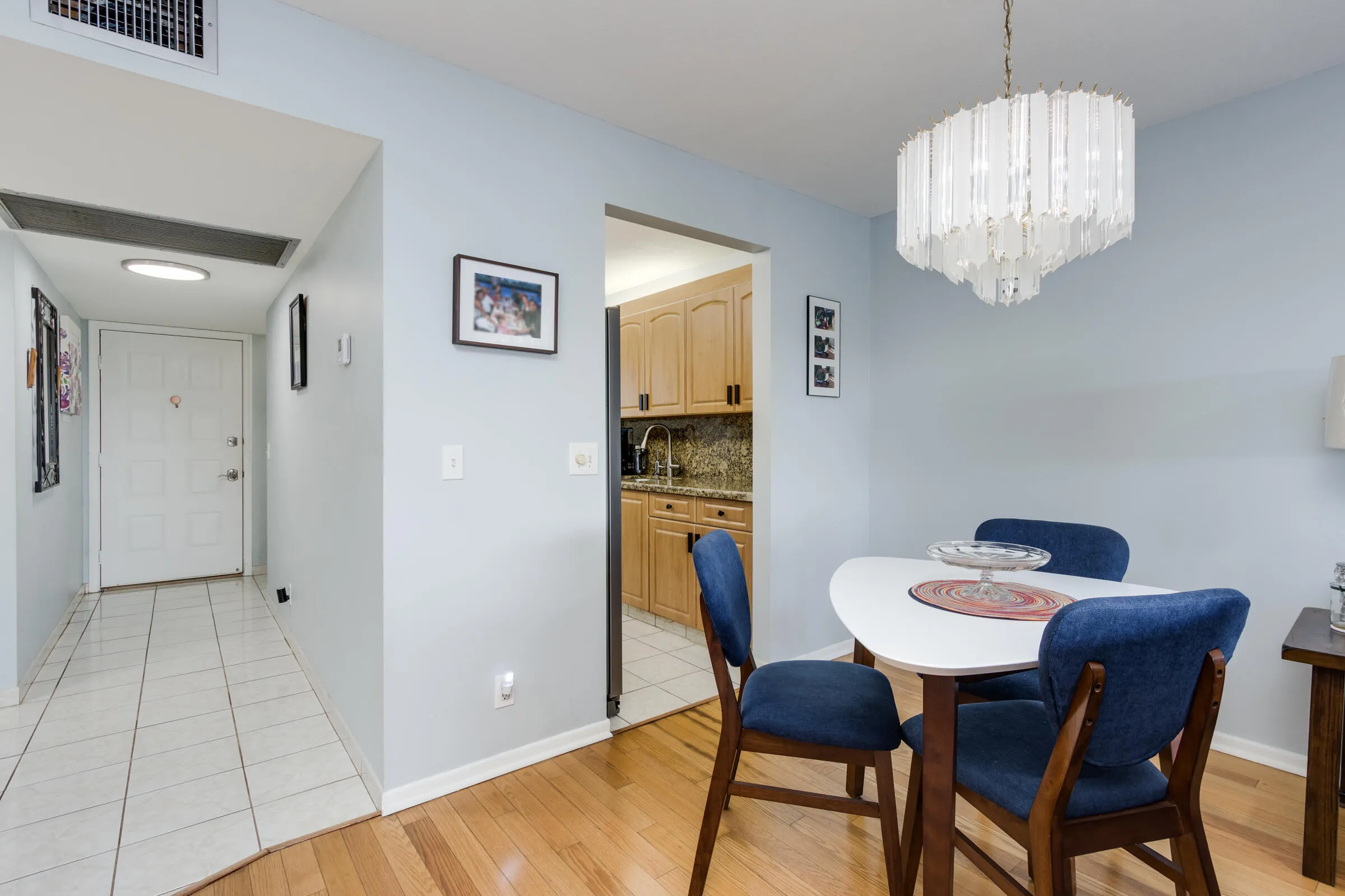 Tiled flooring in foyer and kitchen. with access to dining area.