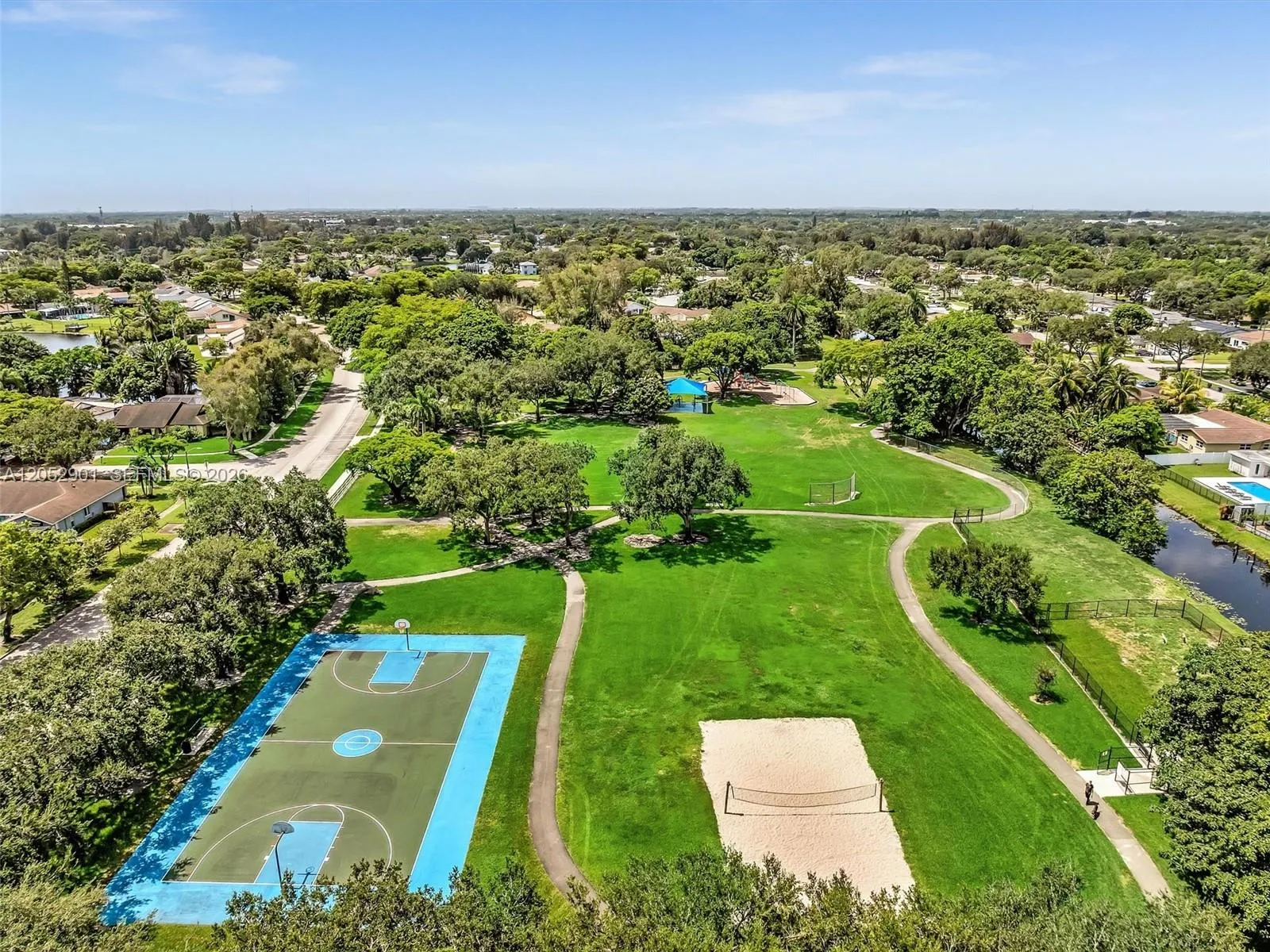Neighborhood park featuring basketball and volleyball courts