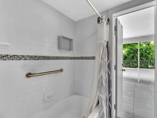 Guest bathroom with cabana door out to back patio