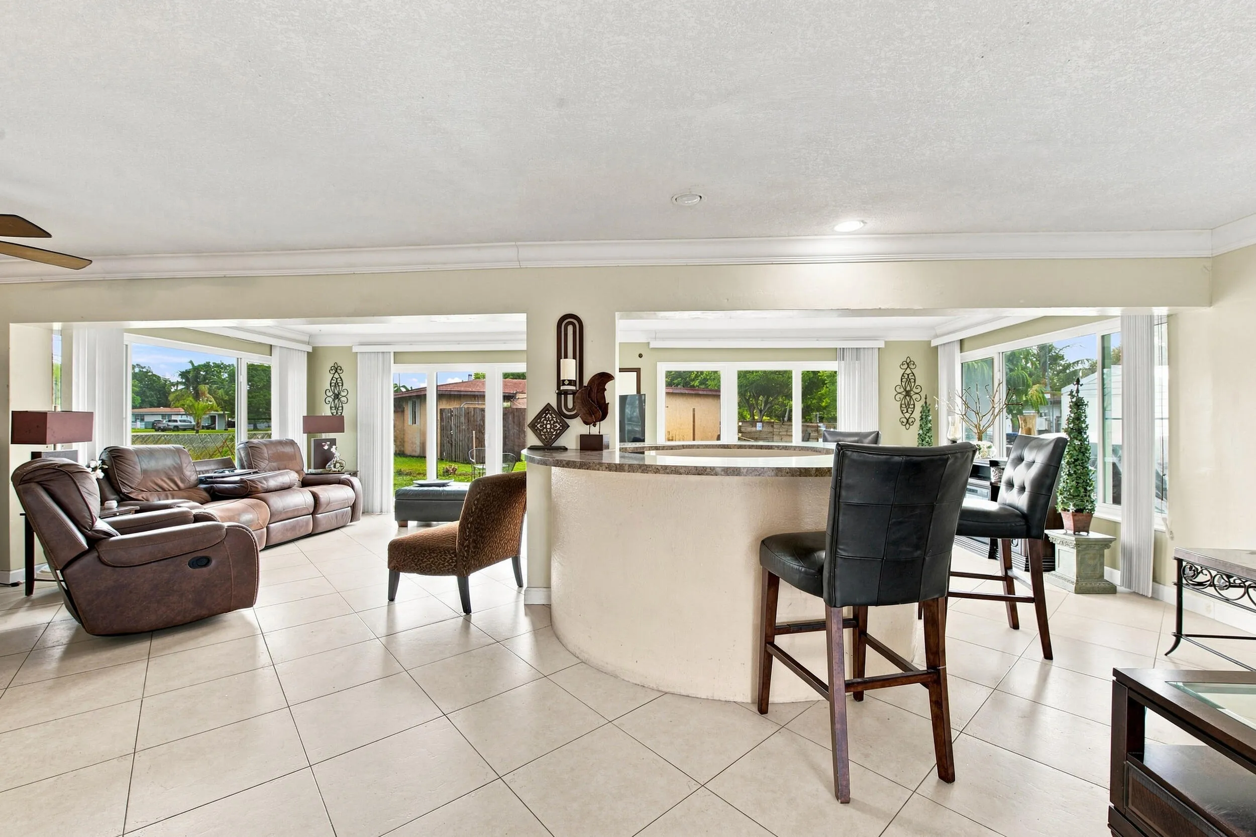 Curved breakfast bar with a stone-finish countertop