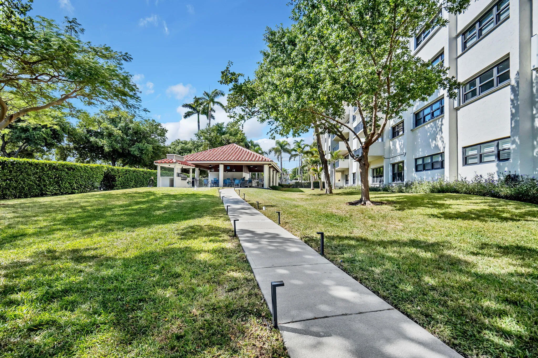 Walkway to the outdoor gazebo and pool from the dock