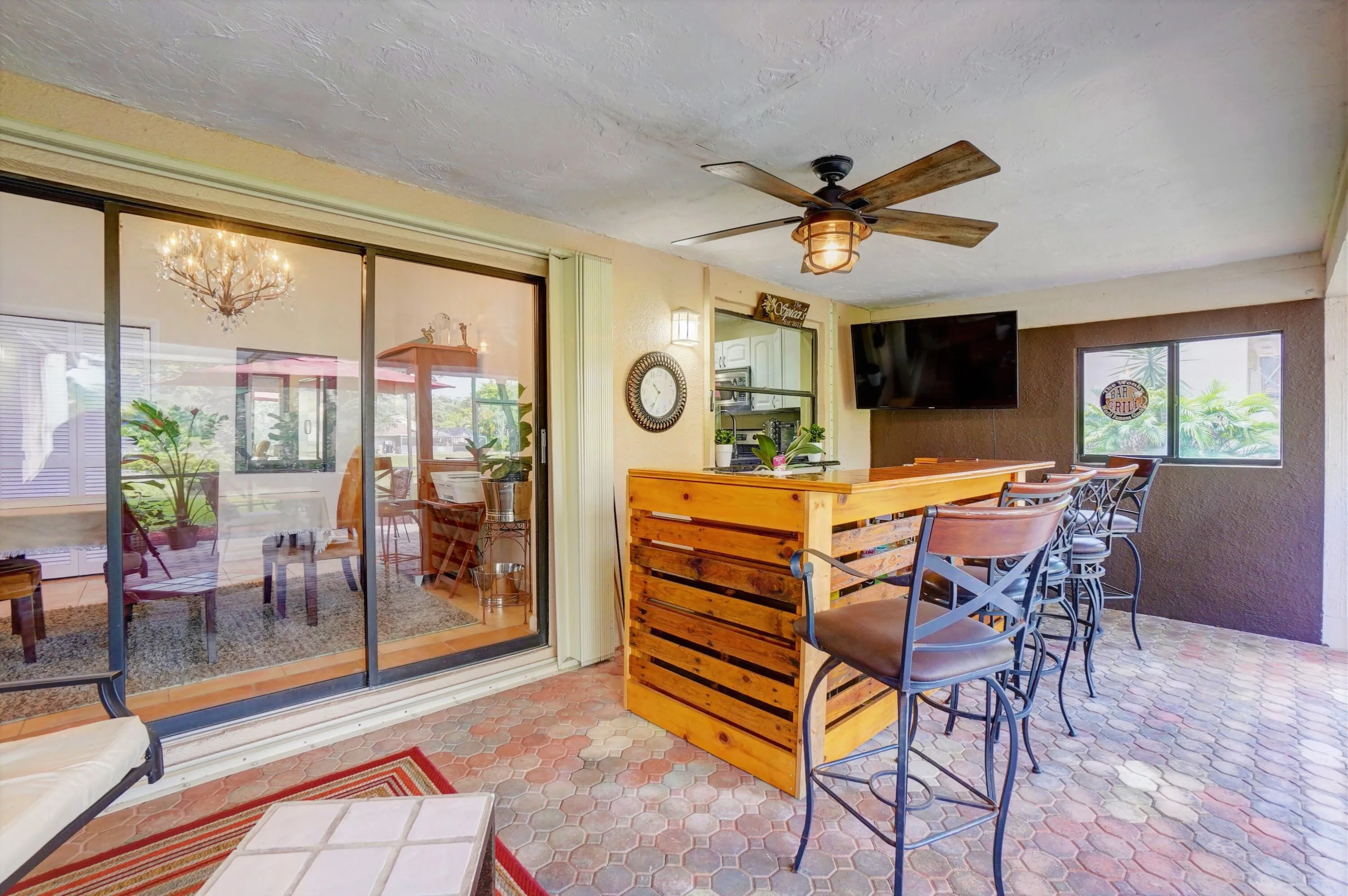 The sliders open up from the dining area to the screened in patio.