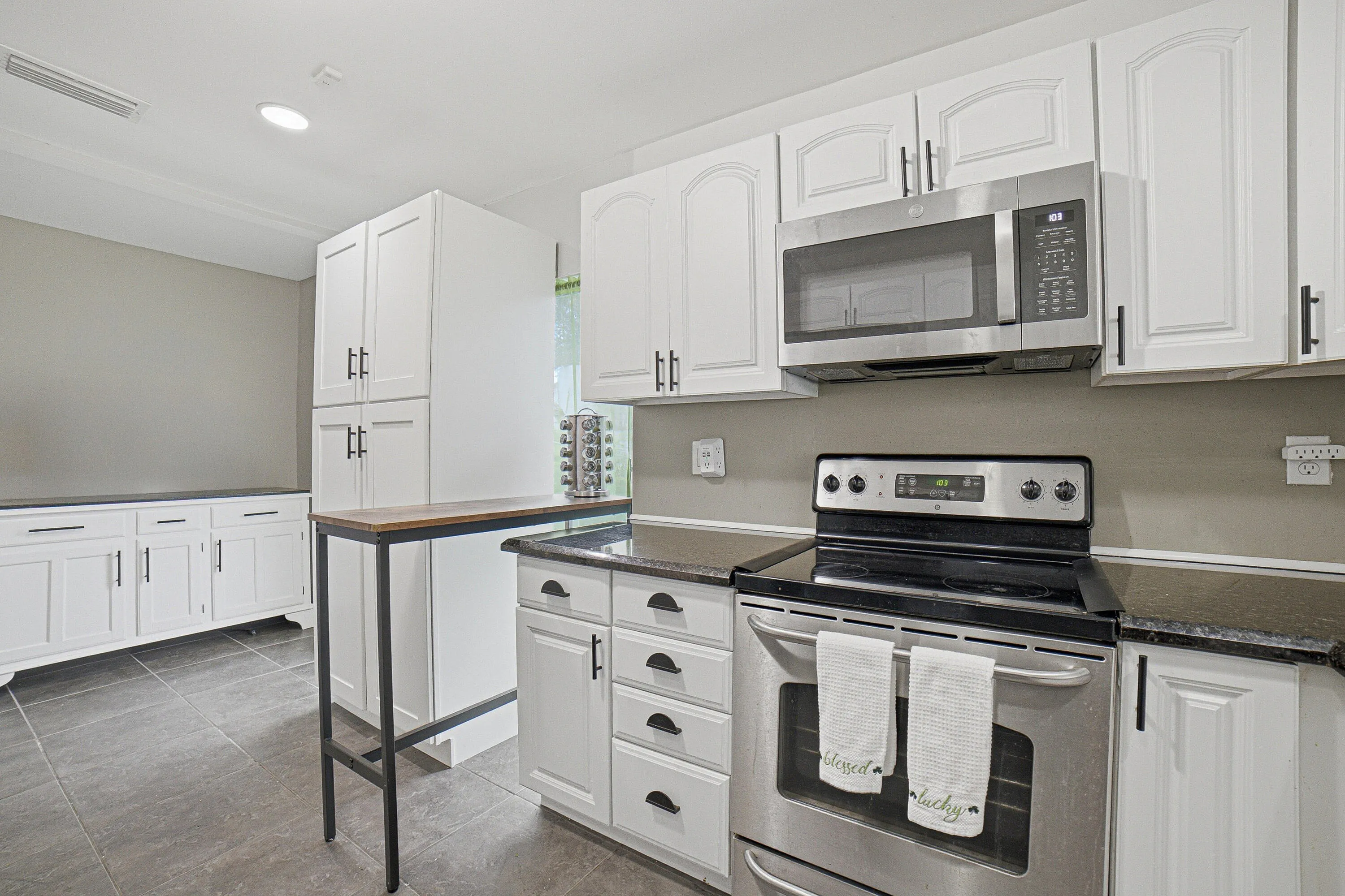 A small peninsula creates a conversational space while your husband cooks.