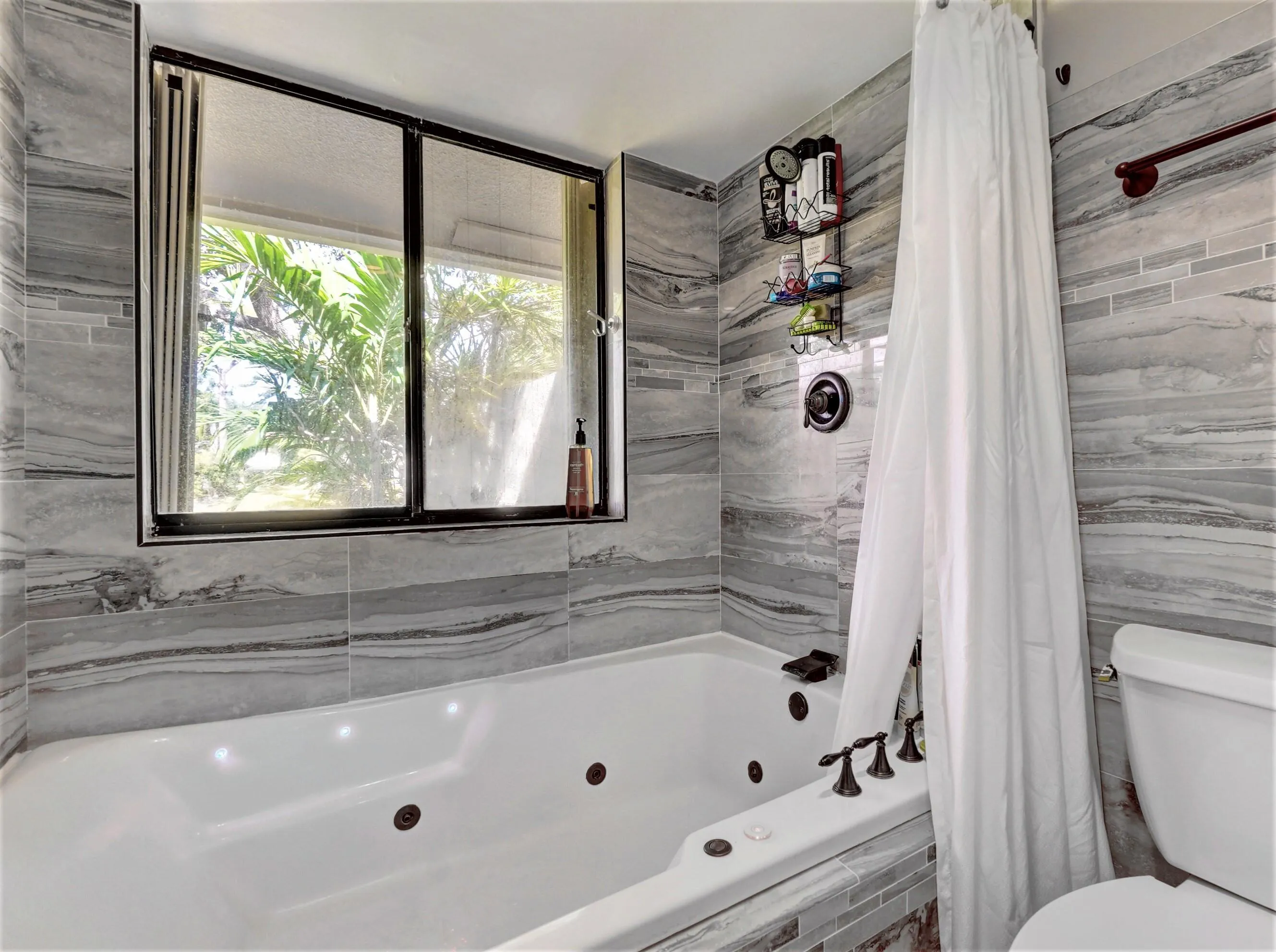Master bath has a double jetted tub and filtered showerhead.