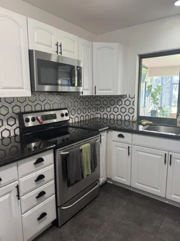 Updated backsplash. All the kitchen pictures do not show this, but new photos are coming soon. The view from the kitchen sink is of the lake and wildlife.
