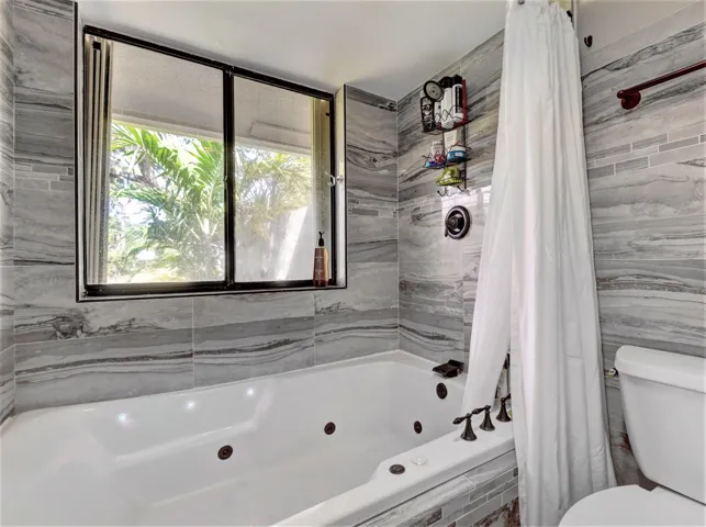Master bath has a double jetted tub and filtered showerhead.