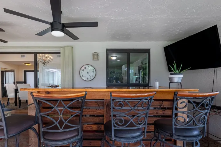 Window is a convenient pass through from the kitchen. Bar and bar chairs stay.