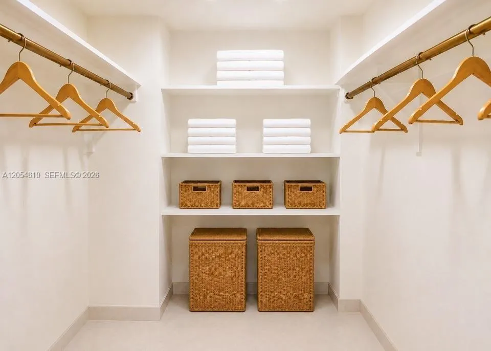 PRINCIPLE BEDROOM SUITE WALK-IN CLOSET ONE ( VIRTUALLY STAGED)