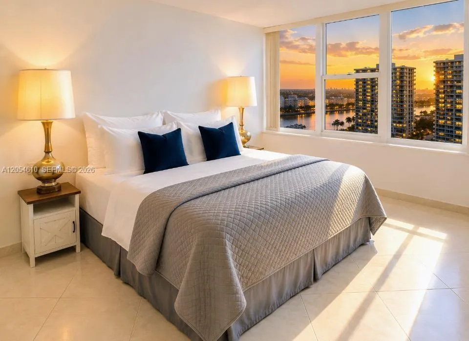 PRINCIPLE BEDROOM WITH KING SIZE BED AND TWO WALK IN CLOSETS AND SITTING OR DRESSING AREA