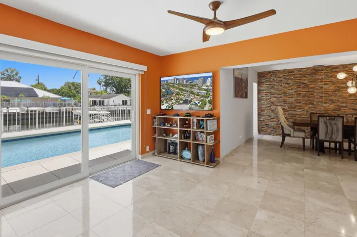 Spacious Family Room. Wall of Impact Glass Sliding Doors.