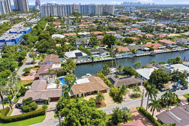 Waterfront community featuring canal access, private docks, mature landscaping, and residential architecture