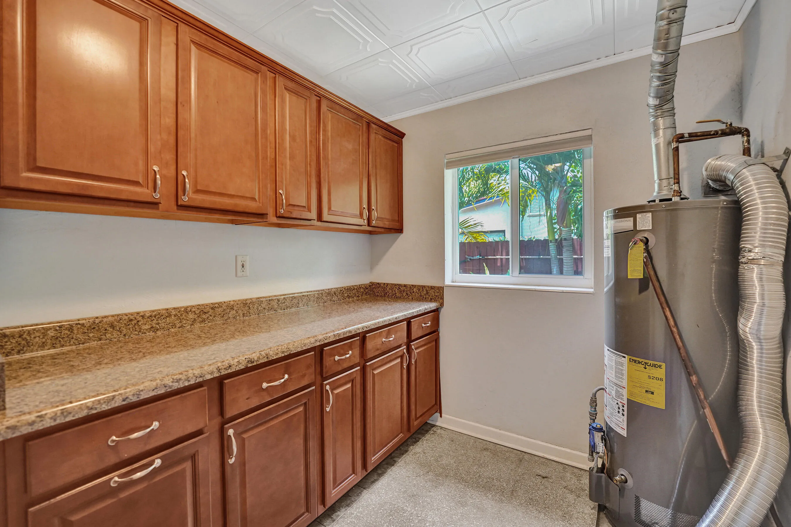 Large Laundry with natural gas hot water heater