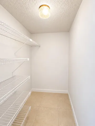 Utility Closet By Entry Hallway