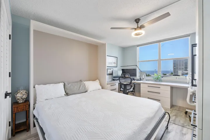 Look at this king size murphy bed in the 2nd bedroom which can easily be made into an office or spacious room in an instant, If guests come to stay use it as a bedroom & when they leave you have your full size office with all built in designer cabinetry!