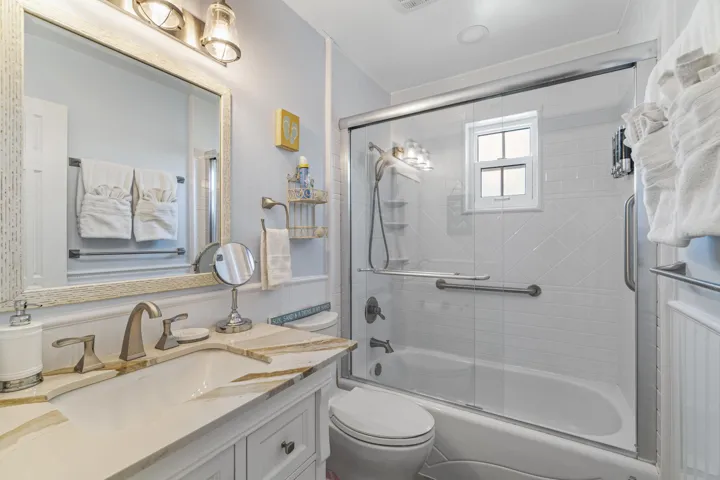 Guest bathroom features bath tub