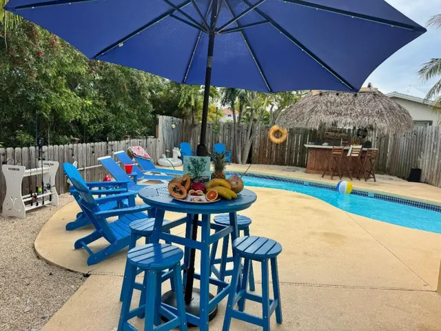 New adirondack chairs throughout exterior of home