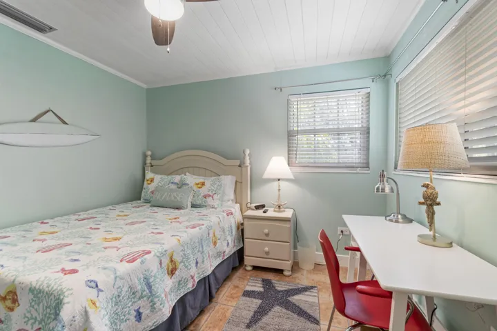 Guest bedroom features closet and flat screen tv