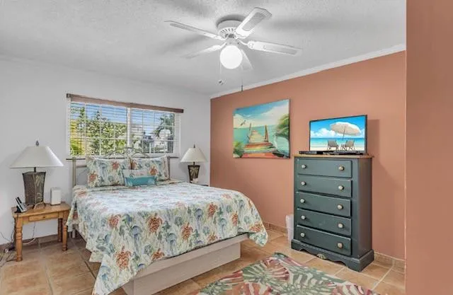Guest bedroom boats flat screen tv and large closet.