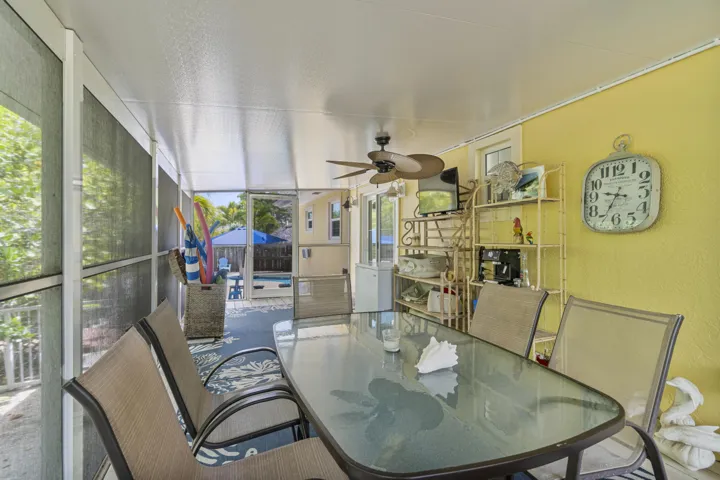 There's a flat screen tv, fans and extra seating on the lanai