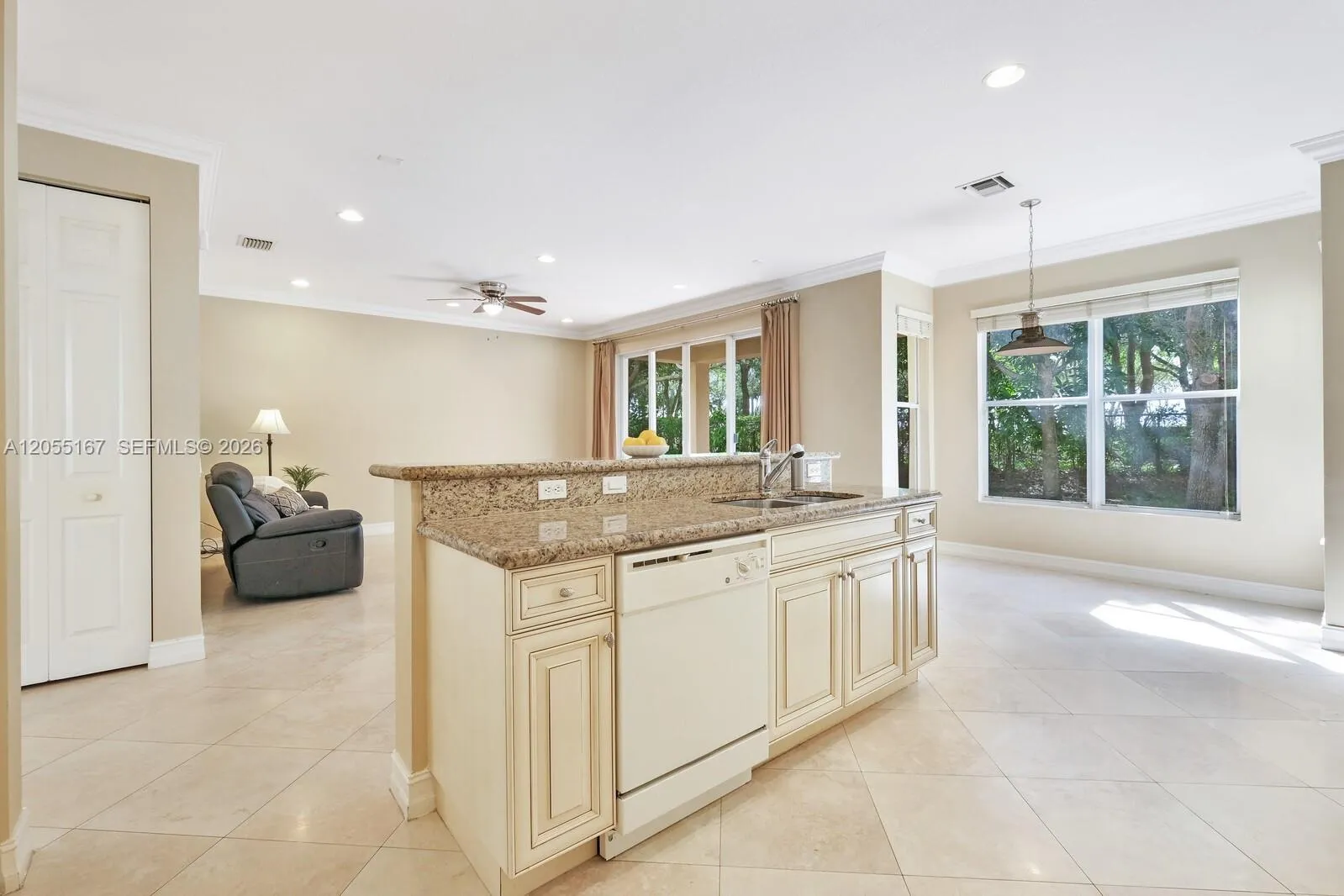 Kitchen Granite Work Space with Bar for Additional Seating Plus Sit-In Dining Area