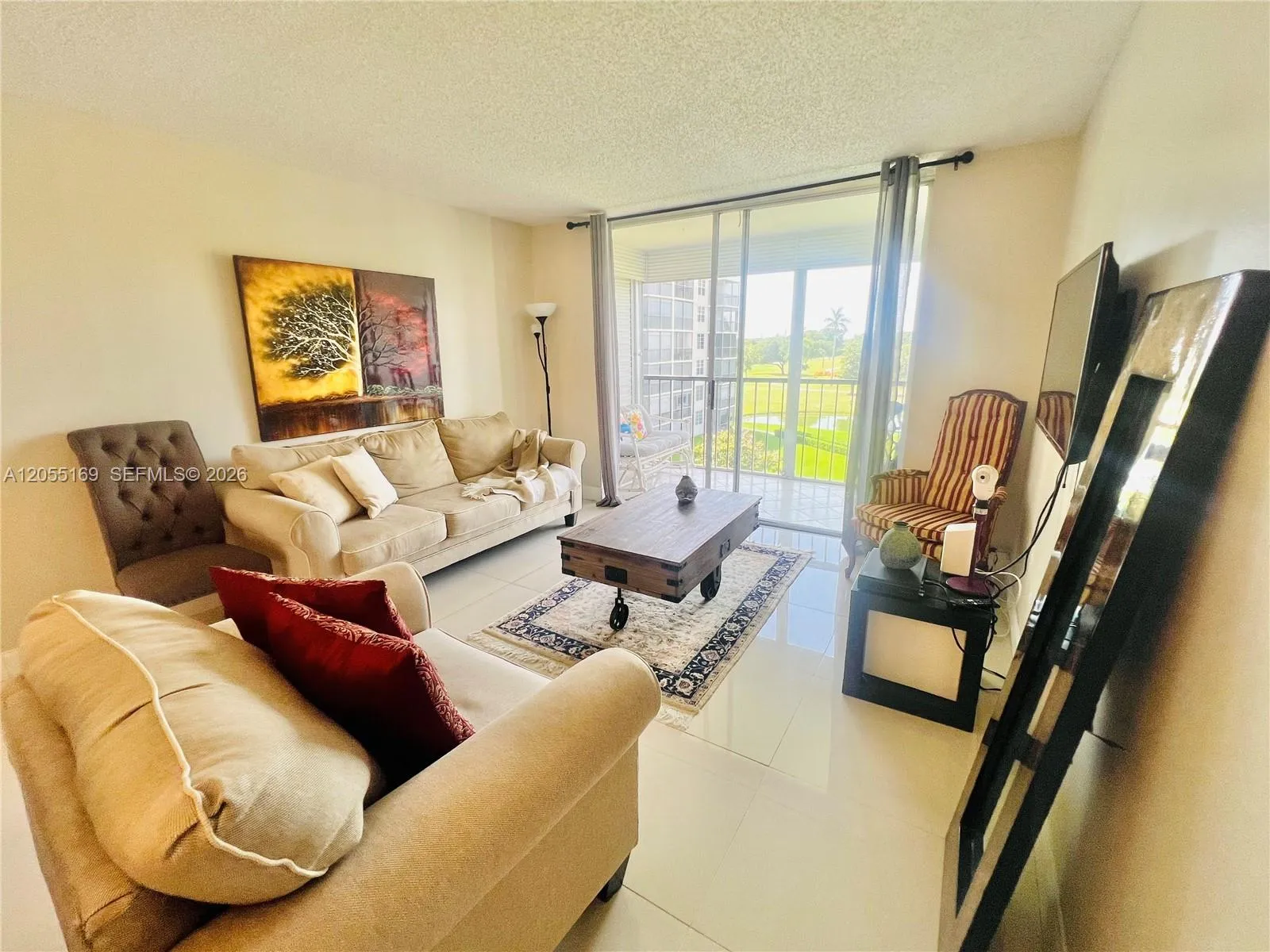 with a stunning view of the golf course and garden