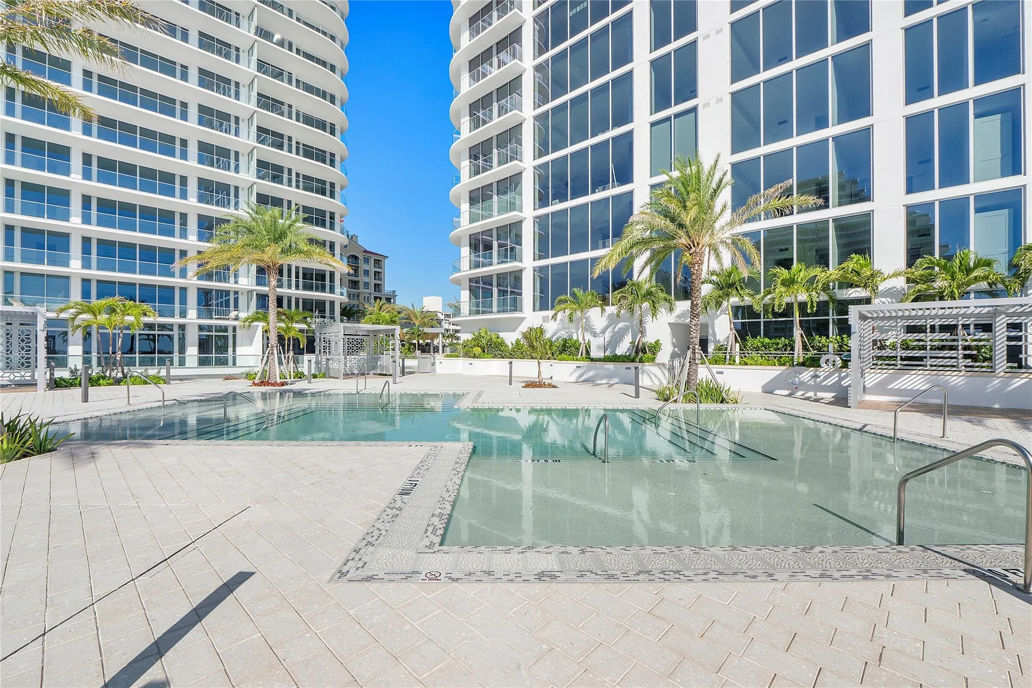 The "sunrise" pool area with beach shelfs & cabanas for tanning & relaxation.