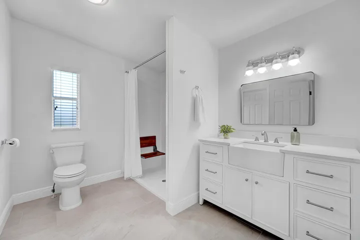 (1 of 2) New Primary bathroom with ADA features low threshold shower, easy access. There are two primary bathrooms