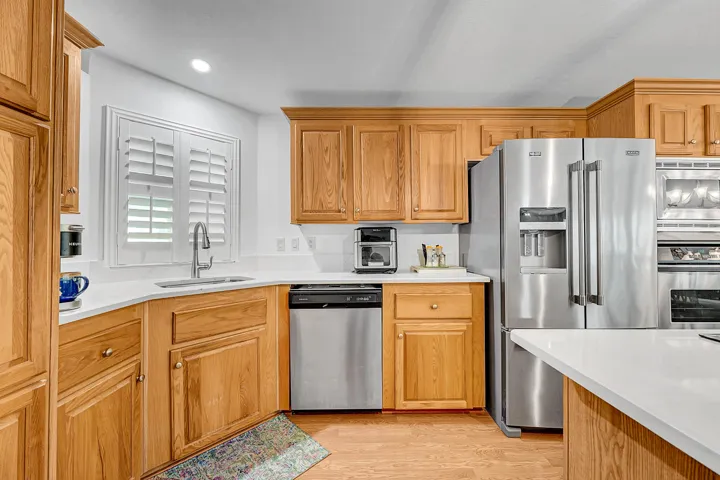 Island Kitchen, newer S/S, quartz counters and wood tone cabinets
