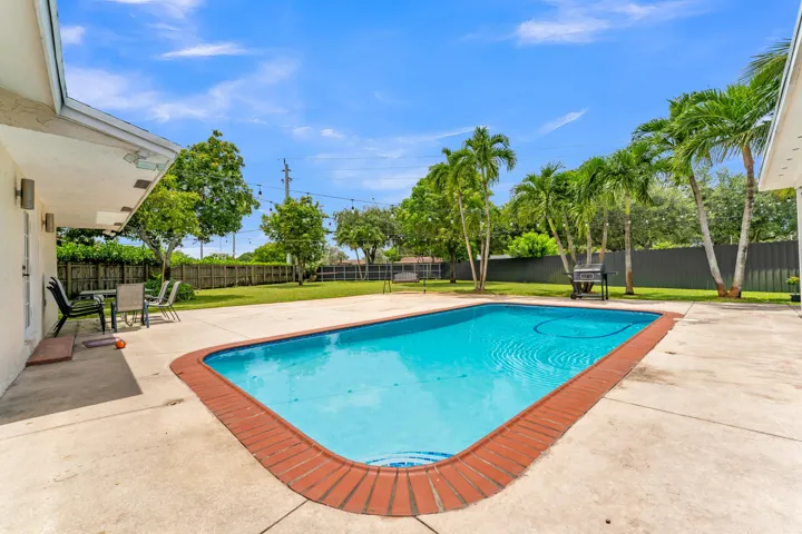 Rectangular swimming pool with brick coping
