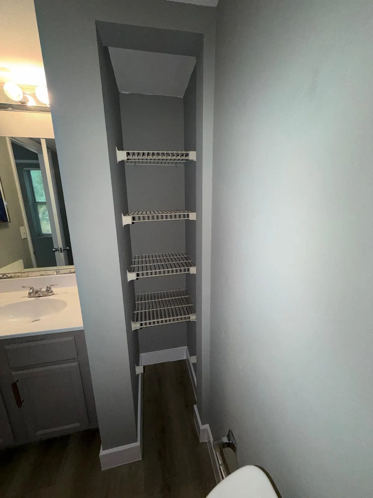 Built-in shelving unit with multiple wire racks