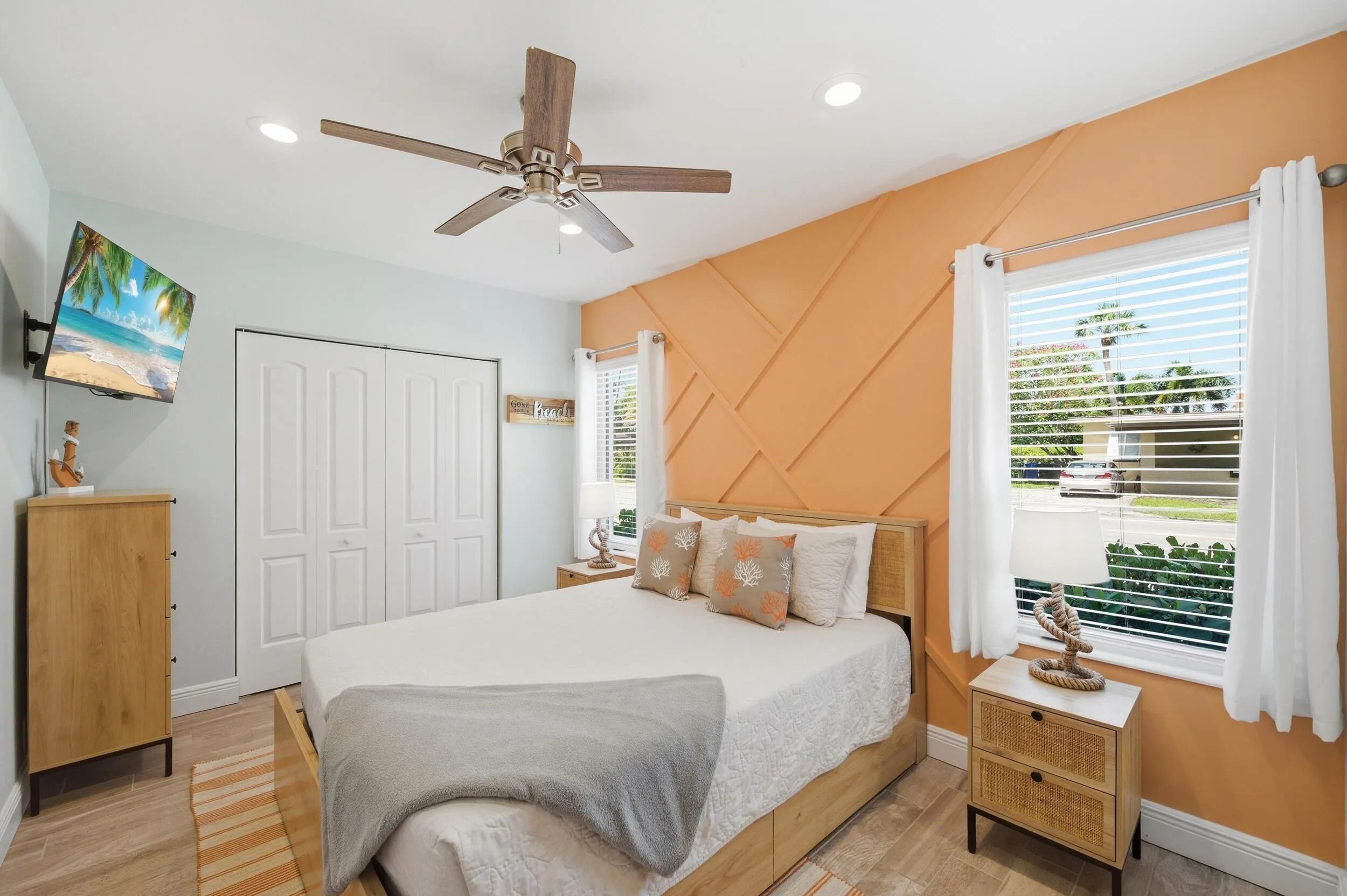 Bedroom featuring wood-finish flooring, a ceiling fan, recessed lighting, and a window with blinds and drapes