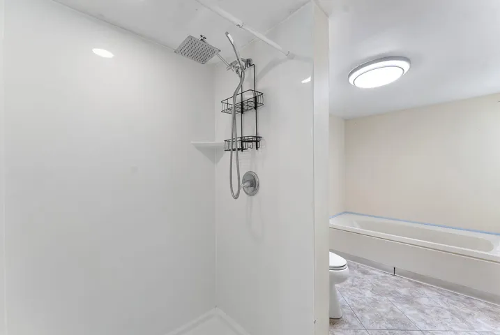 standing shower and tub