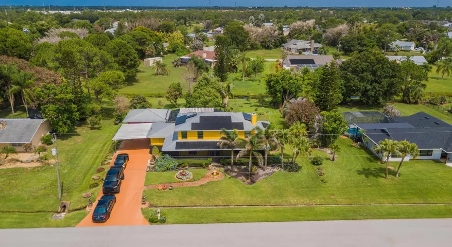 Expansive Driveway & Carport & Detached Garage
