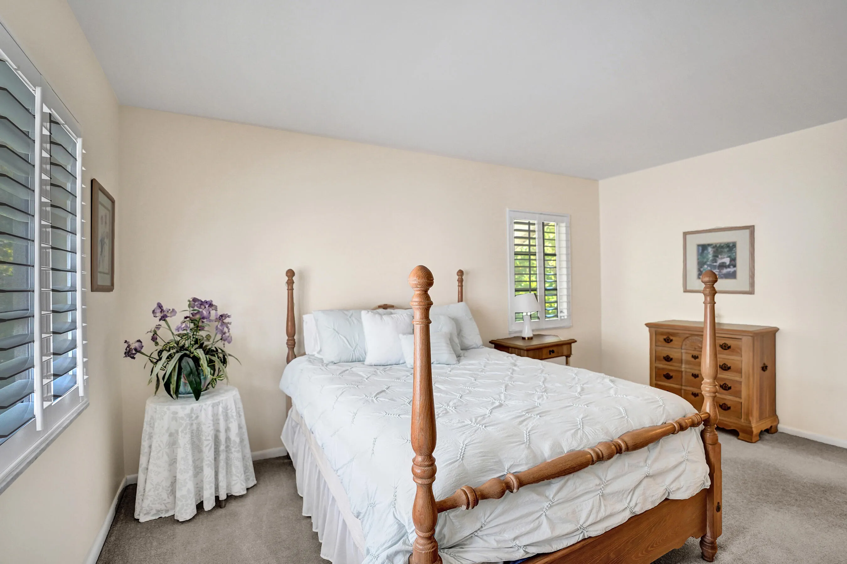 Carpeted bedroom with neutral wall tones