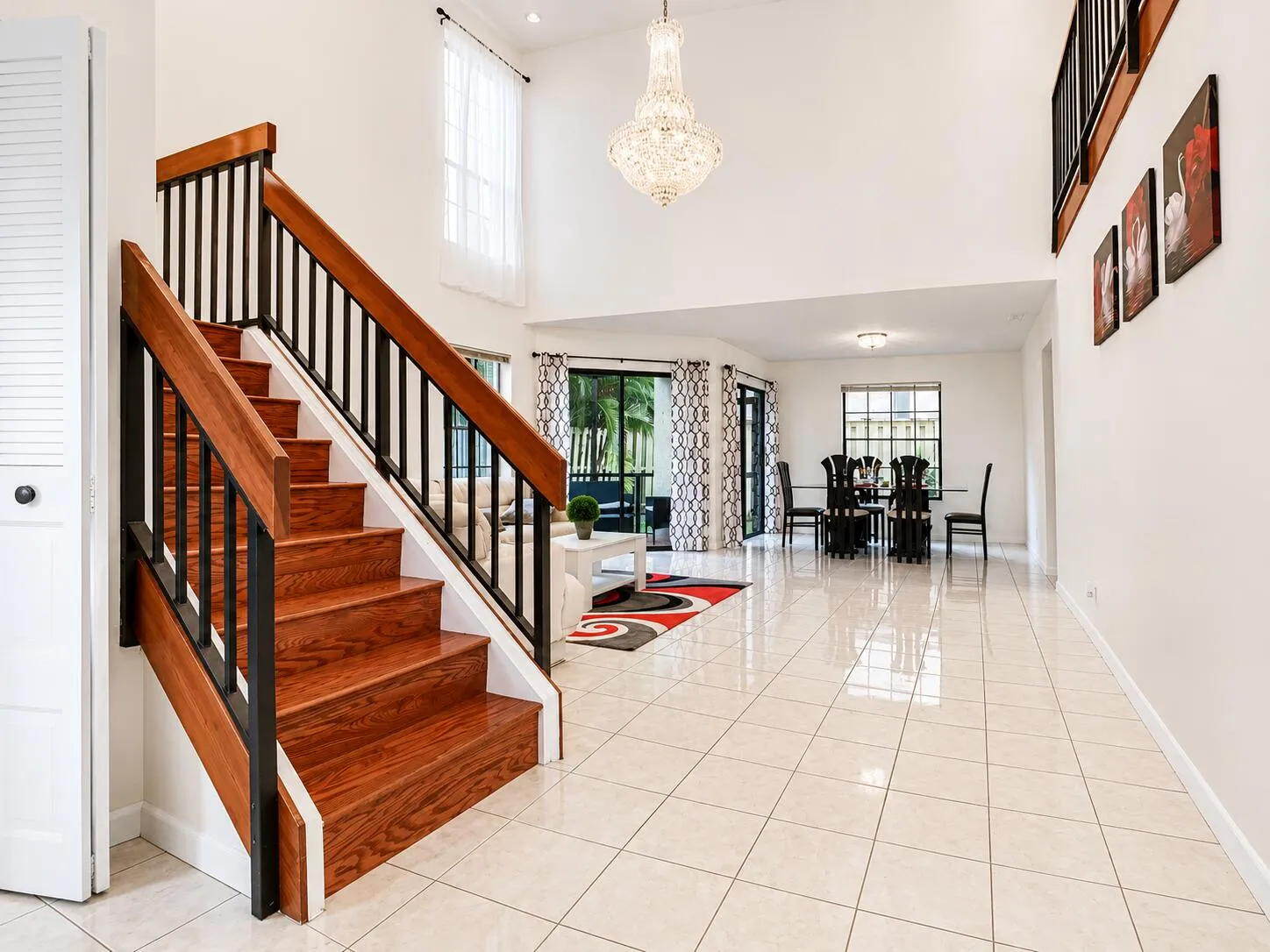 Foyer with High Ceilings in Living Room