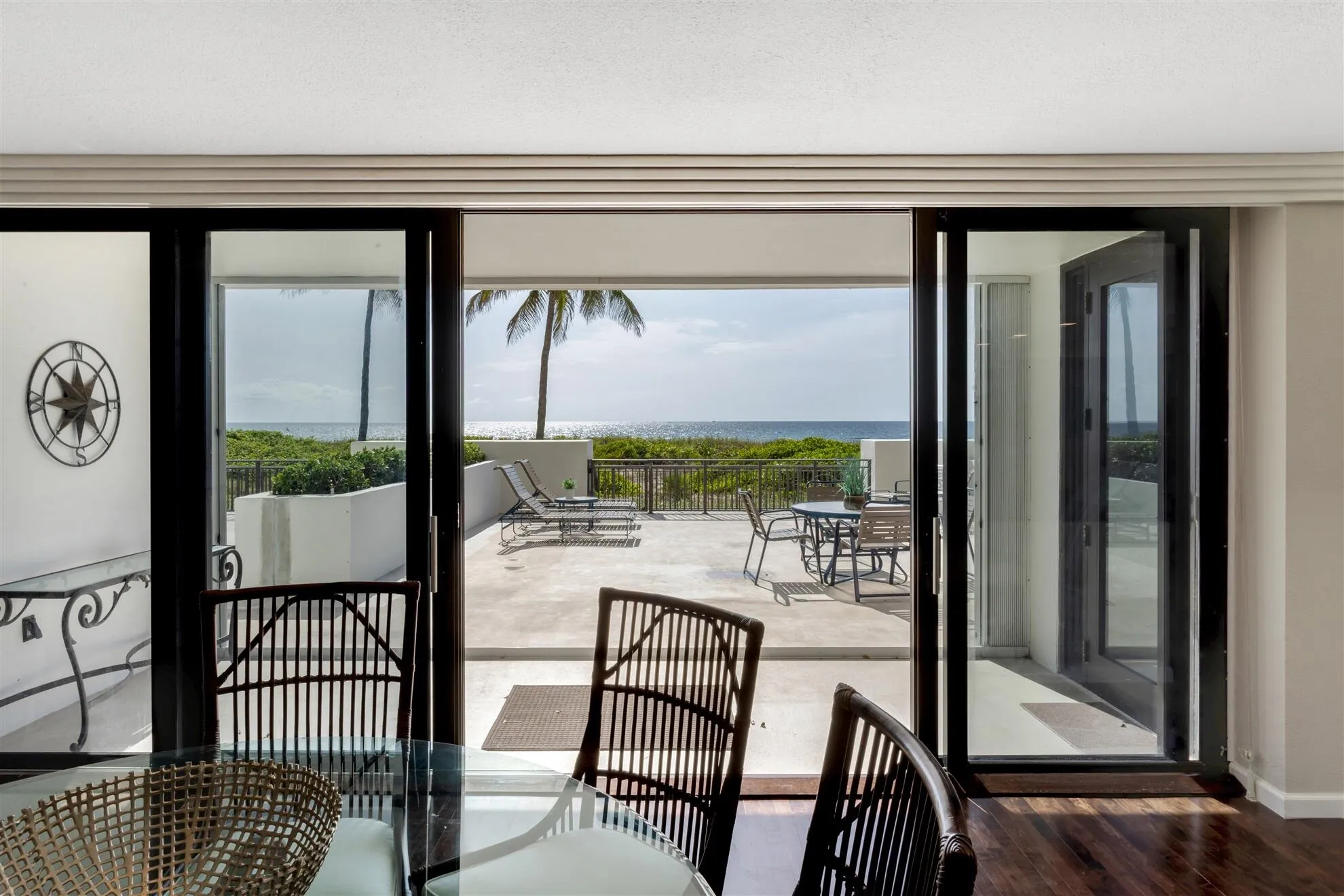 DINING TO PRIVATE PATIO AND OCEAN VIEW