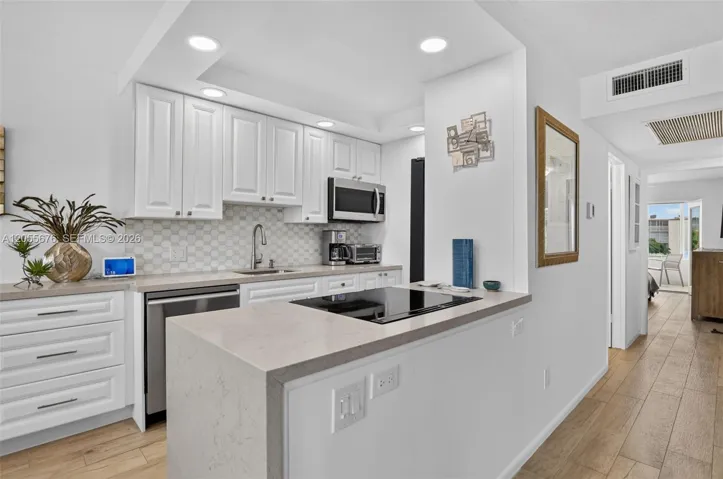 Quartzite waterfall edge completed this spectacular chef's kitchen.
