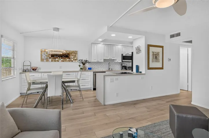 Living room, dining area and kitchen.