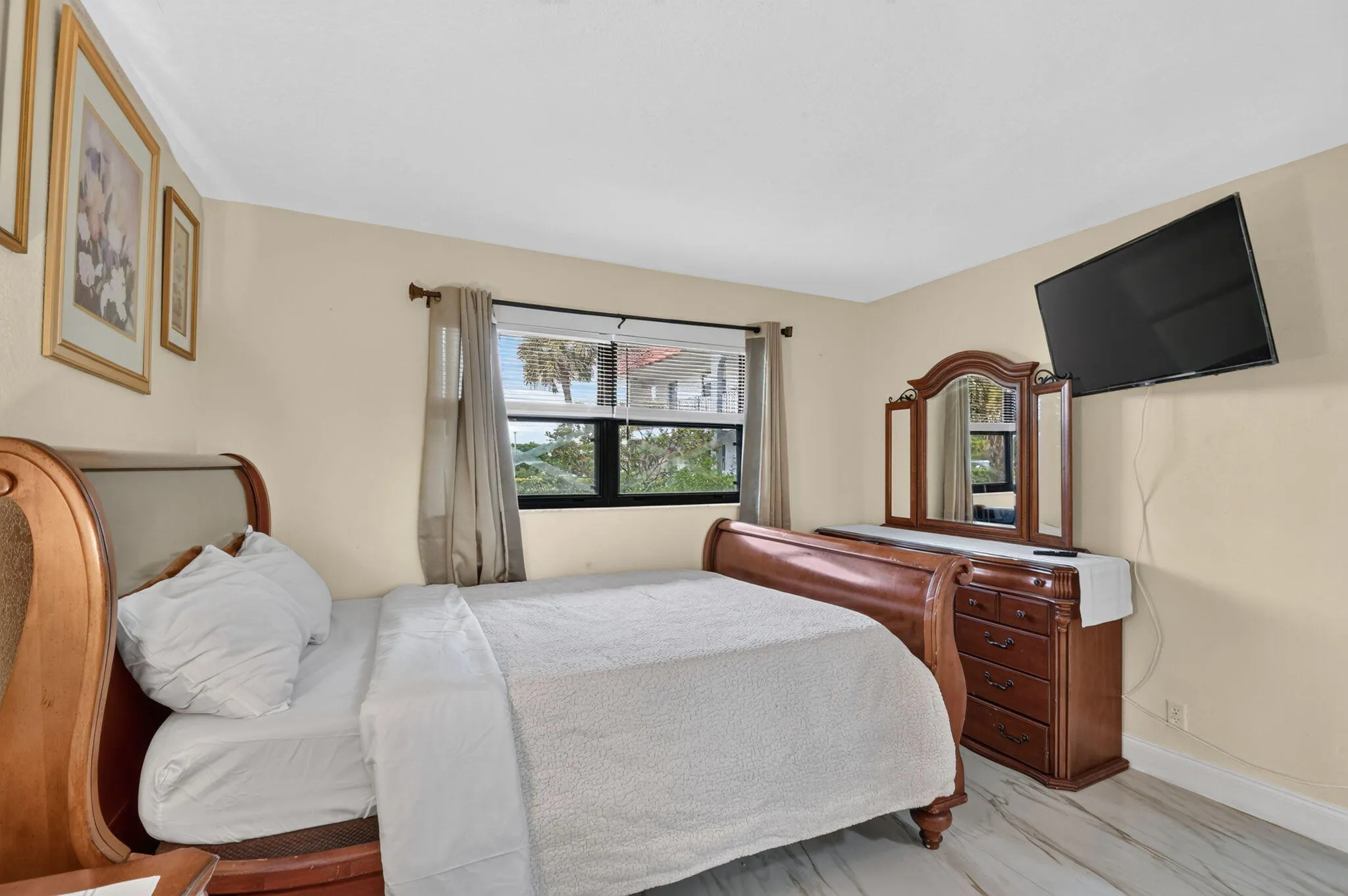 Light-toned walls complement the wood-finish flooring