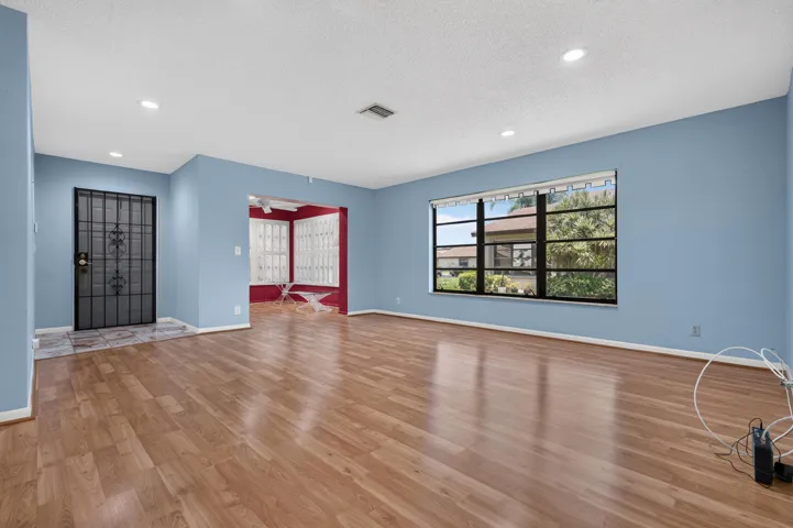 Living room view of the entrance and den