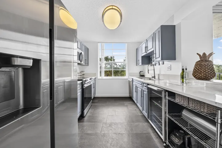 Updated kitchen featuring quartz countertops, stainless steel appliances, and modern finishes.