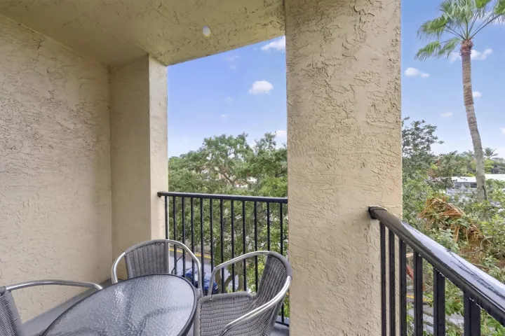 Private balcony with peaceful southeast views—perfect for morning coffee or evening relaxation.