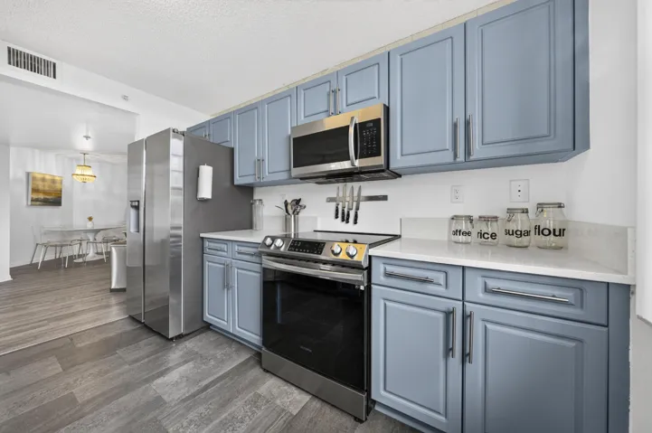 Updated kitchen featuring quartz countertops, stainless steel appliances, and modern finishes.