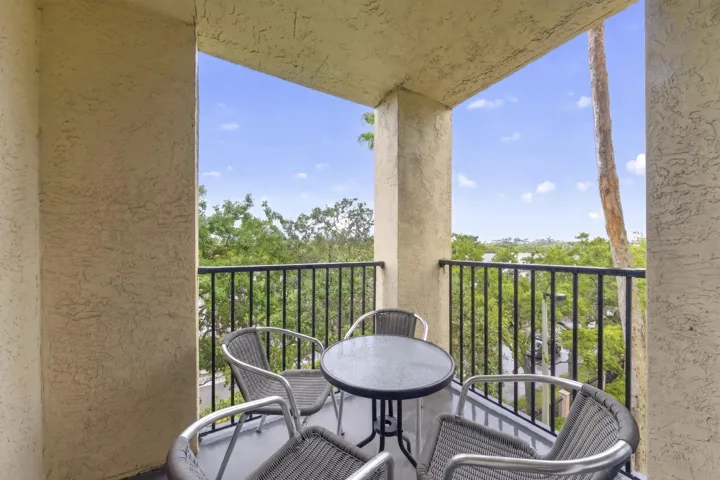 Private balcony with peaceful southeast views—perfect for morning coffee or evening relaxation.
