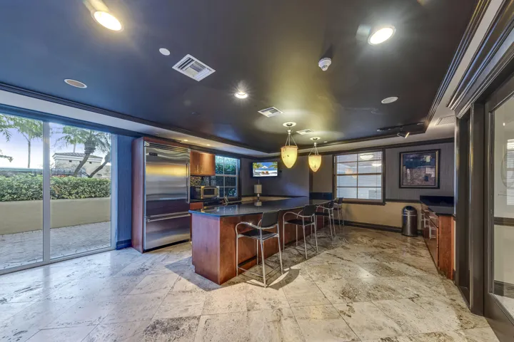 Resident clubroom with an entertaining kitchen—perfect for hosting friends and special occasions.
