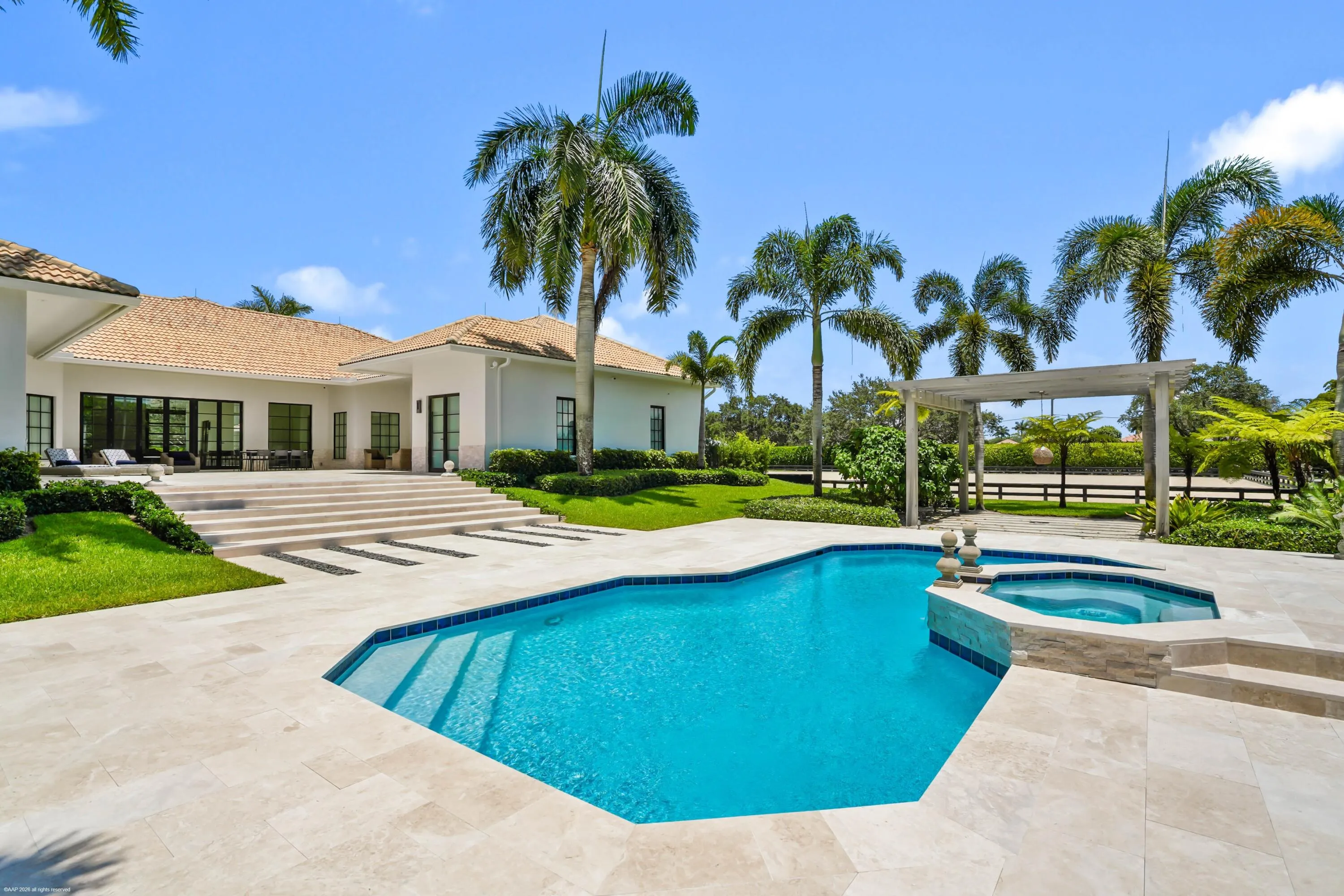 Pool & patio area with main residence beyond