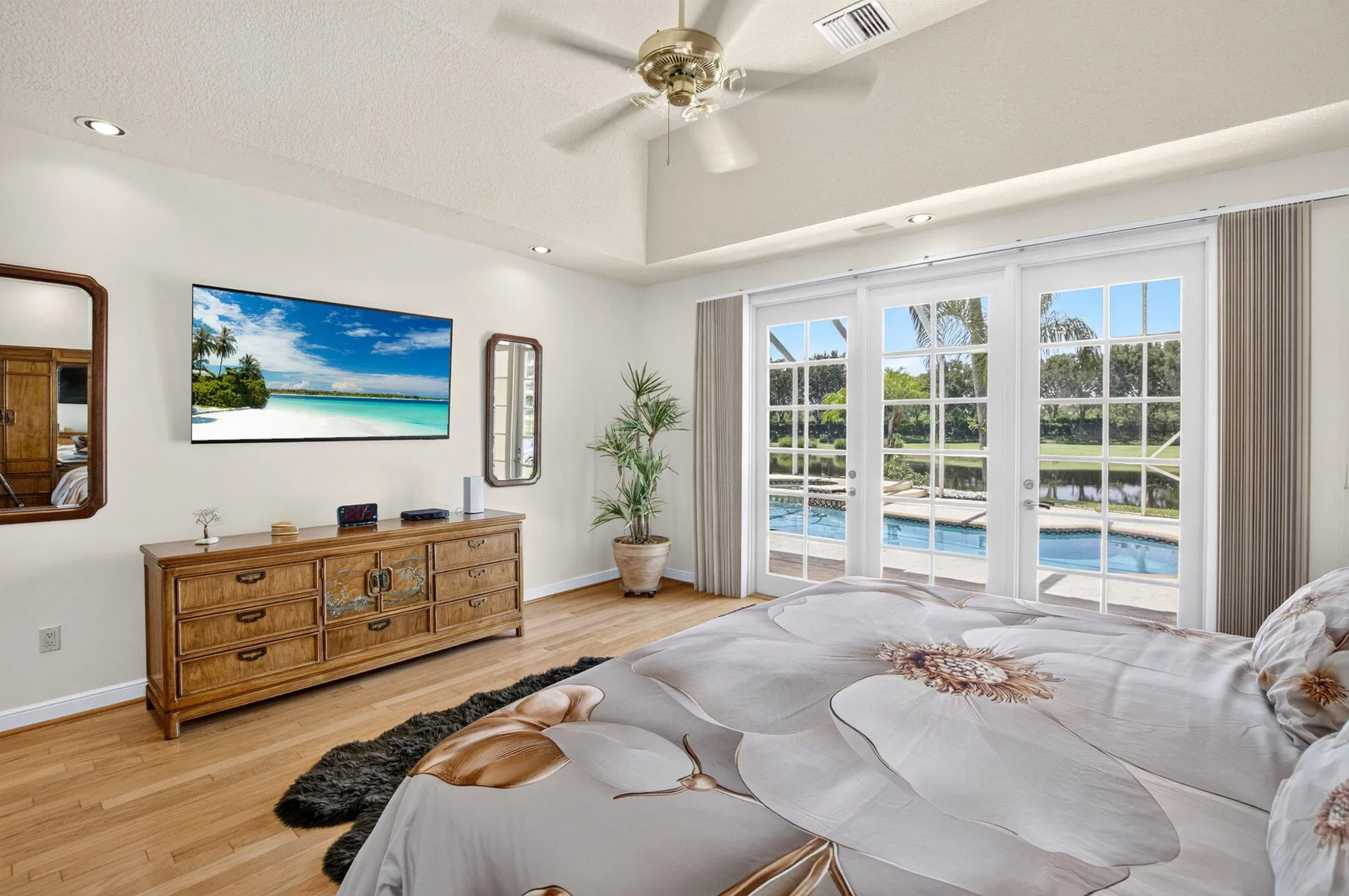 French doors lead to pool area